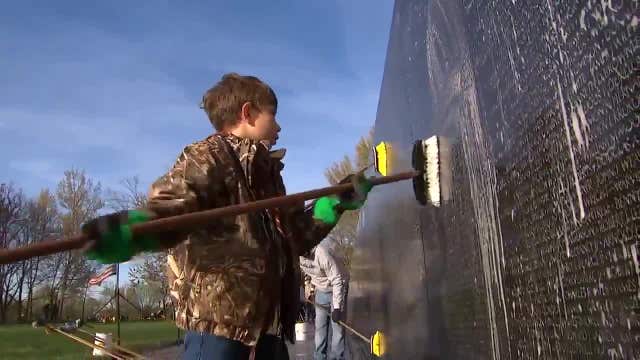 Volunteers wash the Vietnam Veterans Memorial Wall