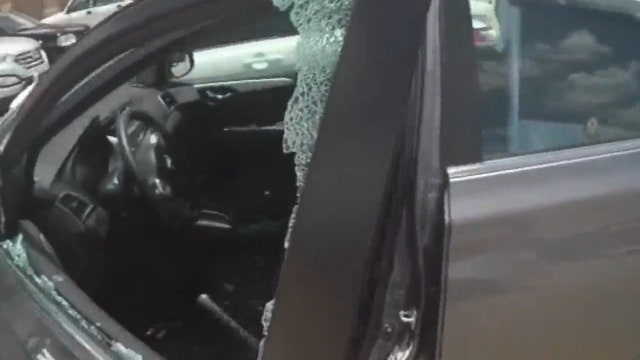 Deputy smashes window to rescue child in hot car