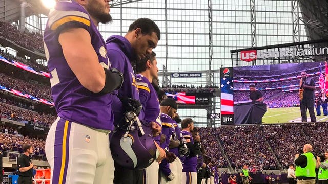 Minnesota Vikings all stand again for National Anthem