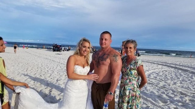 Groom rescues struggling swimmer moments after beach wedding