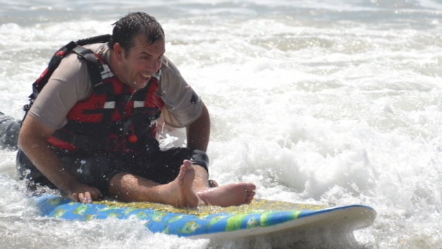 Paralyzed surfer back on his board