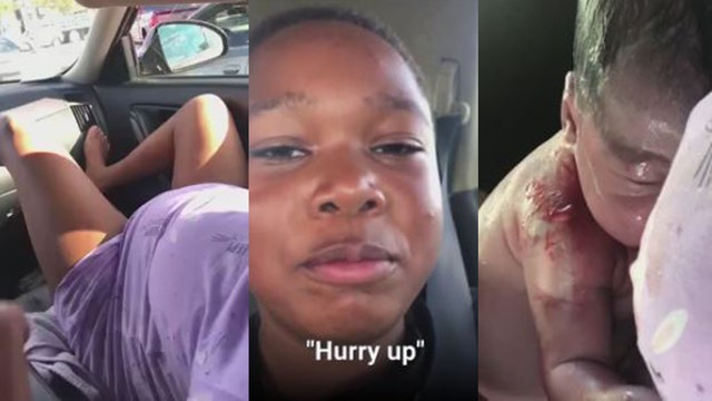 Mom gives birth in car while son records emotional moment from back seat