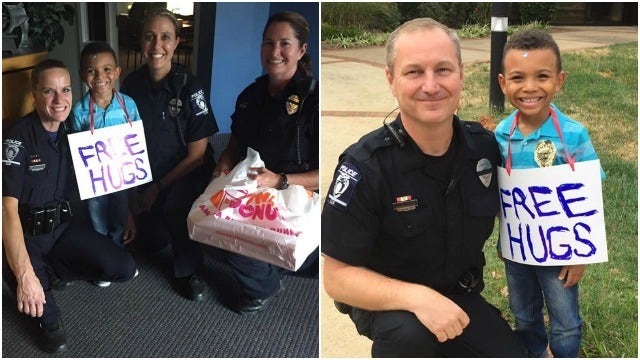 Boy gives Charlotte police free hugs, donuts
