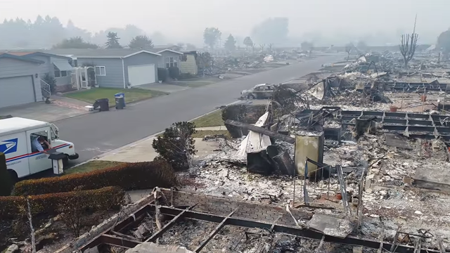 Neither snow, nor rain, nor heat: US postal worker delivers mail to scorched Santa Rosa neighborhood