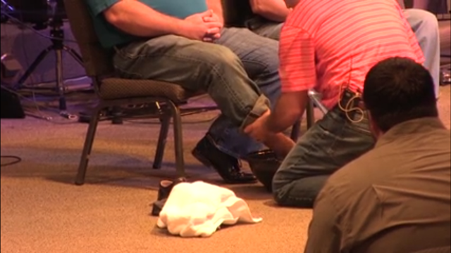 Alabama pastor washes feet of police officers, black church members