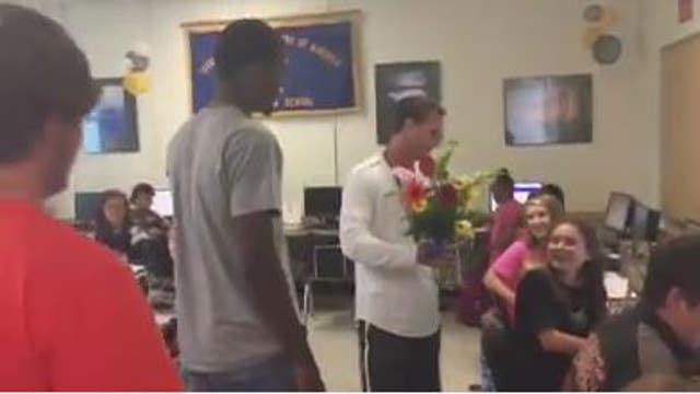 Football team rallies around injured cheerleader