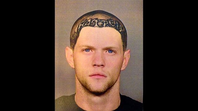 Police seek biker with 'hatred' tattoo in WA shooting