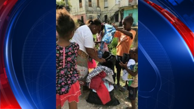 East Point firefighter delivers hundreds of pounds of clothing to Belize