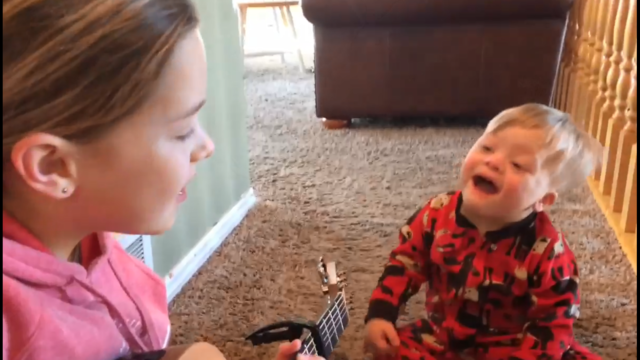 Sister sings 'You are my sunshine' to brother with Down Syndrome in viral post