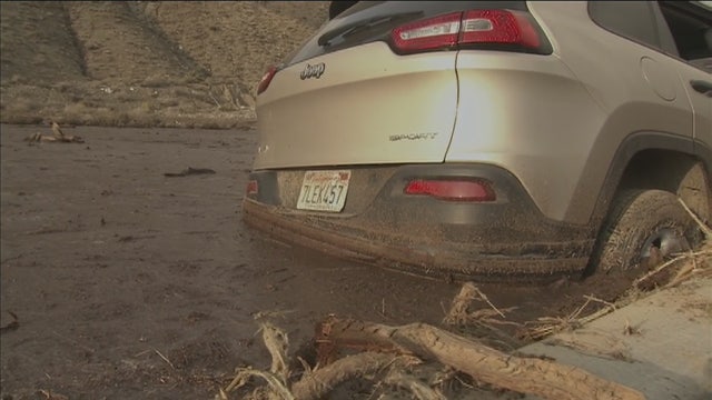 Roads reopen, most stuck vehicles freed from Calif. mud