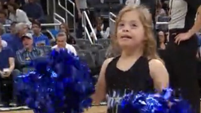 Girl with Down Syndrome dances with 'Magic' cheerleaders