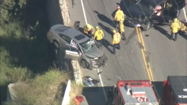 Fire crews rescue two people after car teeters off Malibu cliff