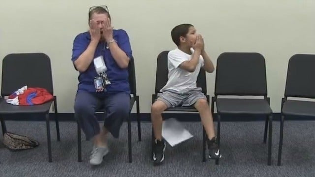 Teacher's emotional reaction to return of Marine son
