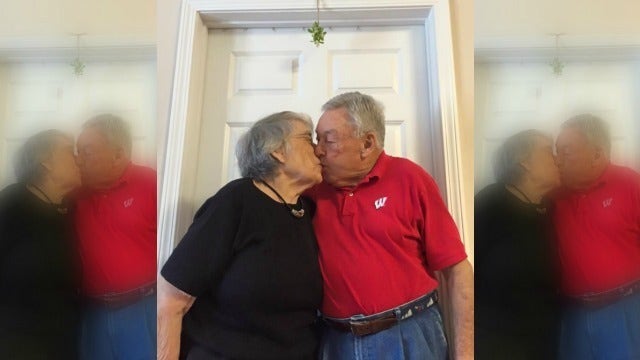 Dunwoody Grandparents Share Sweet Kiss Under Mistletoe