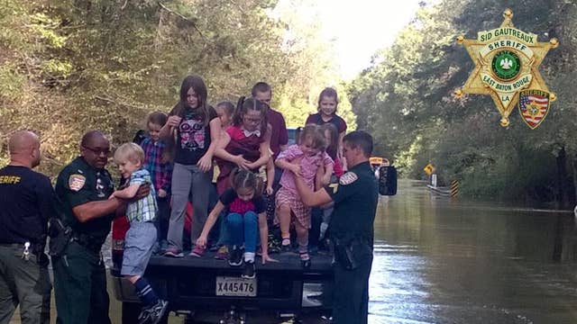 20 Students Rescued from Stranded School Bus on Flooded Bridge