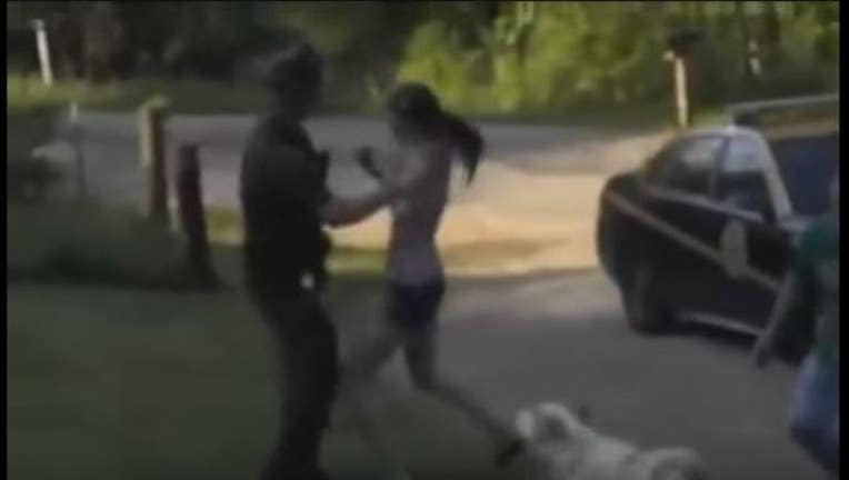 VIDEO - Woman protects her dog from a state trooper-407068.jpg