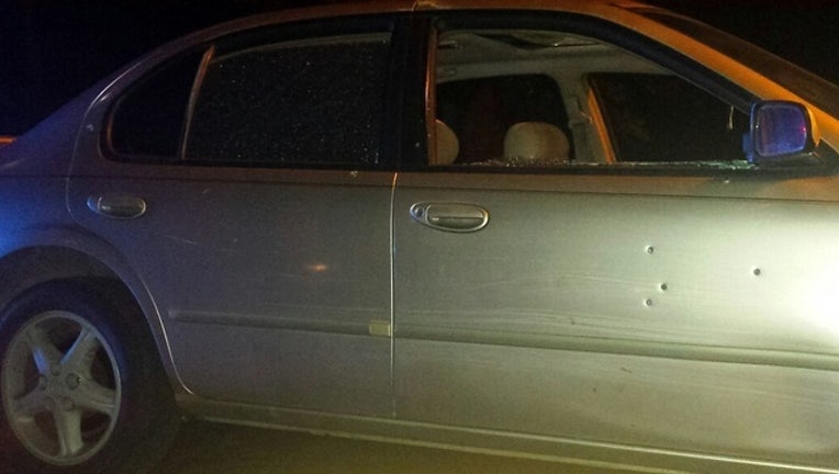 Men shot dirving down the road