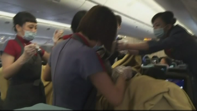 8932a68b-Doctor delivers baby on flight