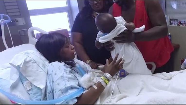 8e1455f0-Mother holds baby for the first time_1499696582454-403440.JPG
