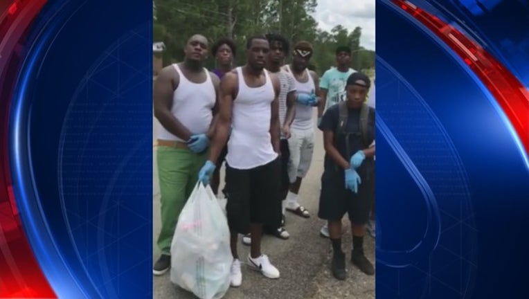 42ebc403-Neighbor shares video of Georgia teens cleaning up community_1500766647409.jpg
