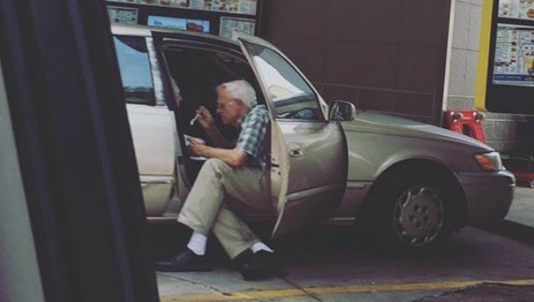 b56ed7bc-elderly man feeds wife_1501158924097.jpg