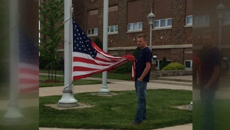 ohio teen holds flag_1464347785552.jpg