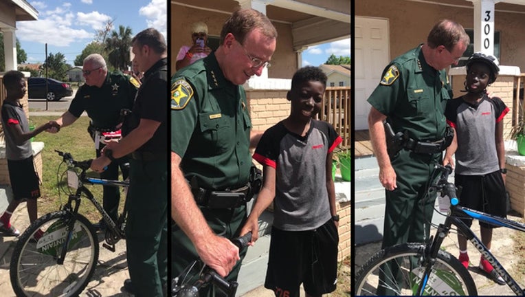 polk sheriff surprises boy with new bike_1553973541797.jpg-401385.jpg