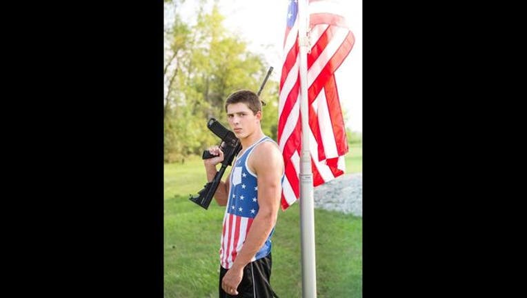 Josh Renville yearbook photo with gun-409162