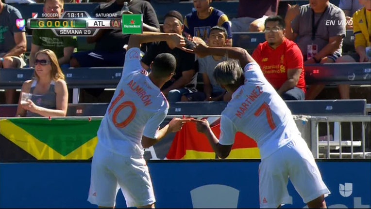 42c6afa9-Miguel Almiron and Josef Martinez celebrate