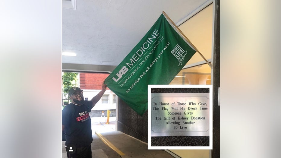 Brendon Blair poses next to a transplant flag that is flown each time an organ recipient receives a transplant