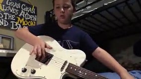 Boy battling brain cancer receives guitar from country music star