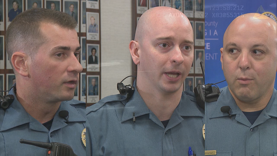 Police officers save man pinned by car