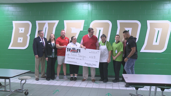 Roofing company pays off school lunch debts in Buford
