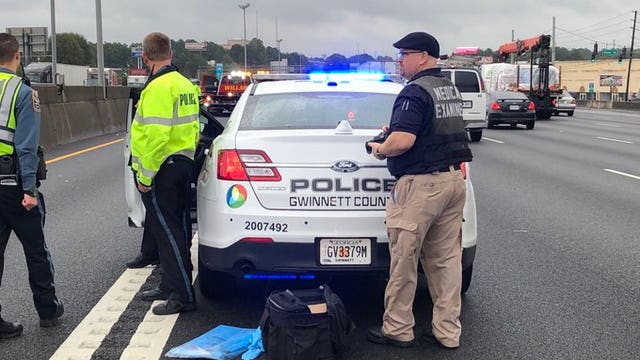 Police: Woman found dead in car along I-85 in Gwinnett County