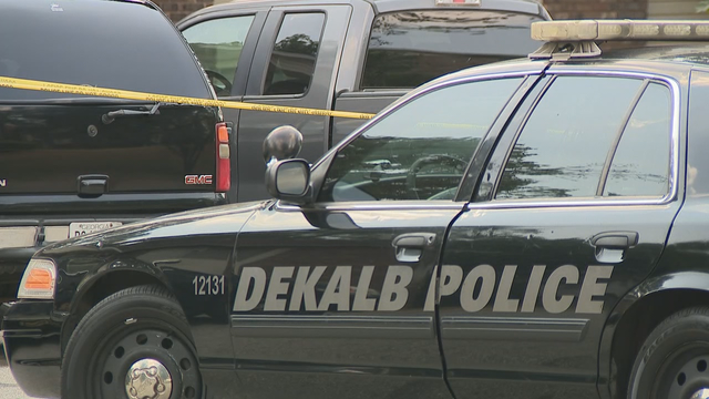 Woman shot in crossfire on DeKalb County road, dies at hospital