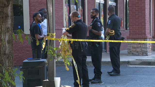 Shooting outside a barber shop sends 3 people to the hospital