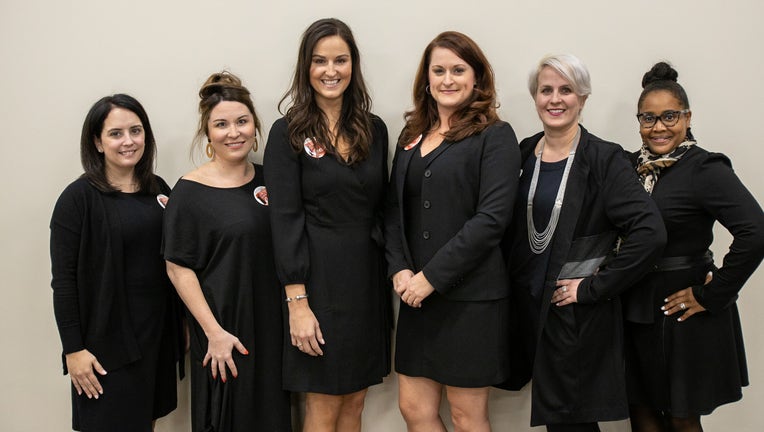 women in little black dresses