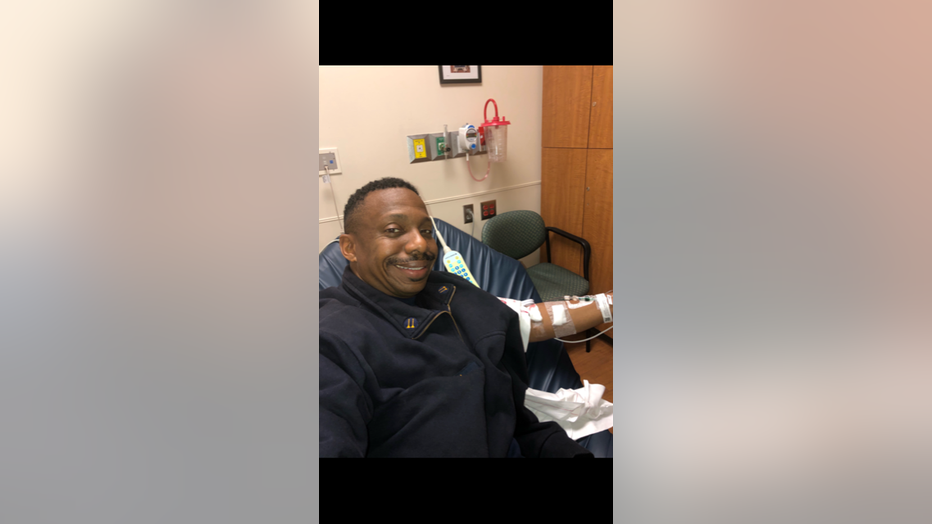 Firefighter receives an IV infusion in the emergency department, where he was treated January 19, 2019