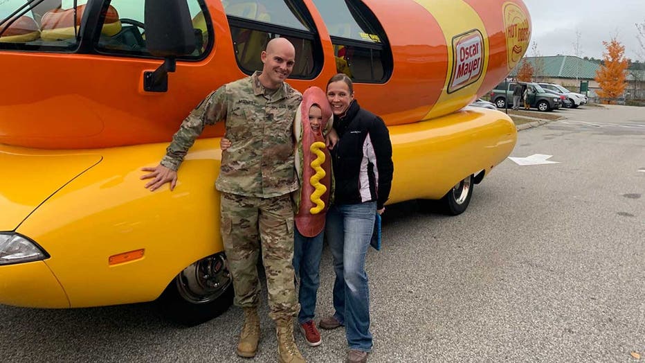 Jake, seen here with dad Craig and mom Kari, was treated to a ride in the famous Wienermobile on Monday.