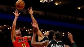 Young dazzles in 2nd half, Hawks beat Spurs without Collins