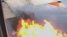 Plane departing LAX makes emergency landing after flames spew from engine