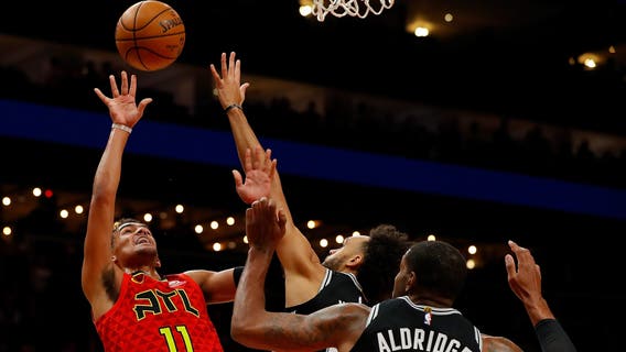 Young dazzles in 2nd half, Hawks beat Spurs without Collins