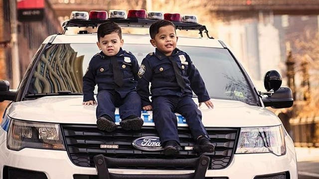 Toddler 'NYPD lieutenant' twins travel the country to honor police officers