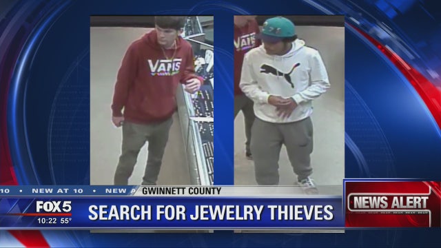 Police search for 2 men who ran off with gold chains
