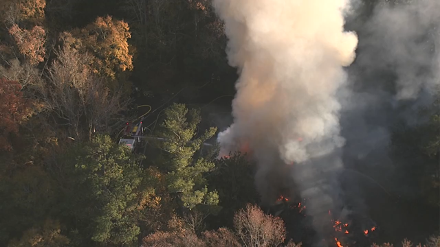 Firefighter: Massive Cobb County house fire sparked in garage