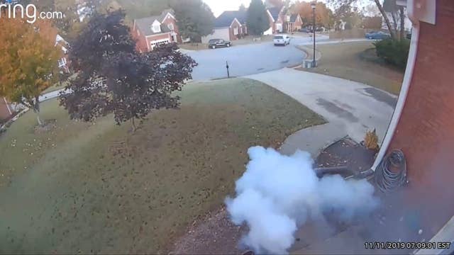 Man caught on camera throwing explosive toward home