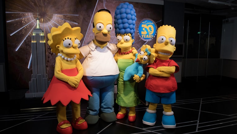 Actors dressed as members of the Simpsons Family in