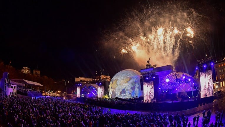 Fireworks are seen during the public show for the 30th anniversary of the fall of the Berlin Wall, on November 9, 2019 at the Brandenburg Gate in Berlin. Germany on Saturday celebrates 30 years since the fall of the Berlin Wall ushered in the end of communism and national reunification.