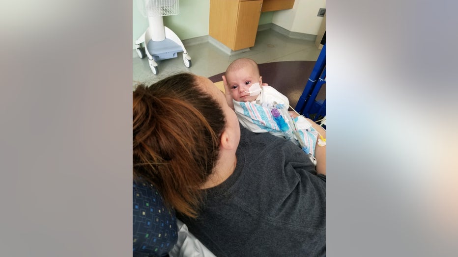 Mom holds baby in the hospital