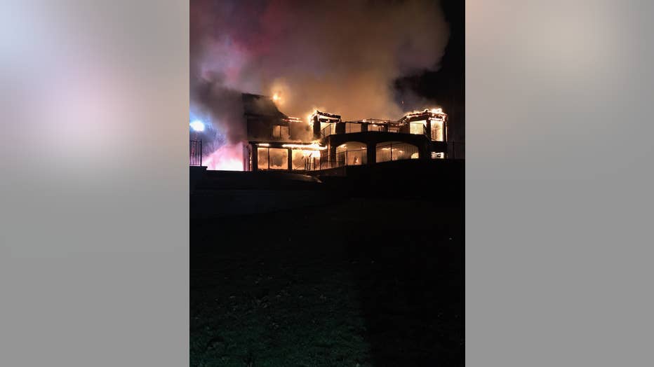 Firefighters battle a two-story house fire in Hall County